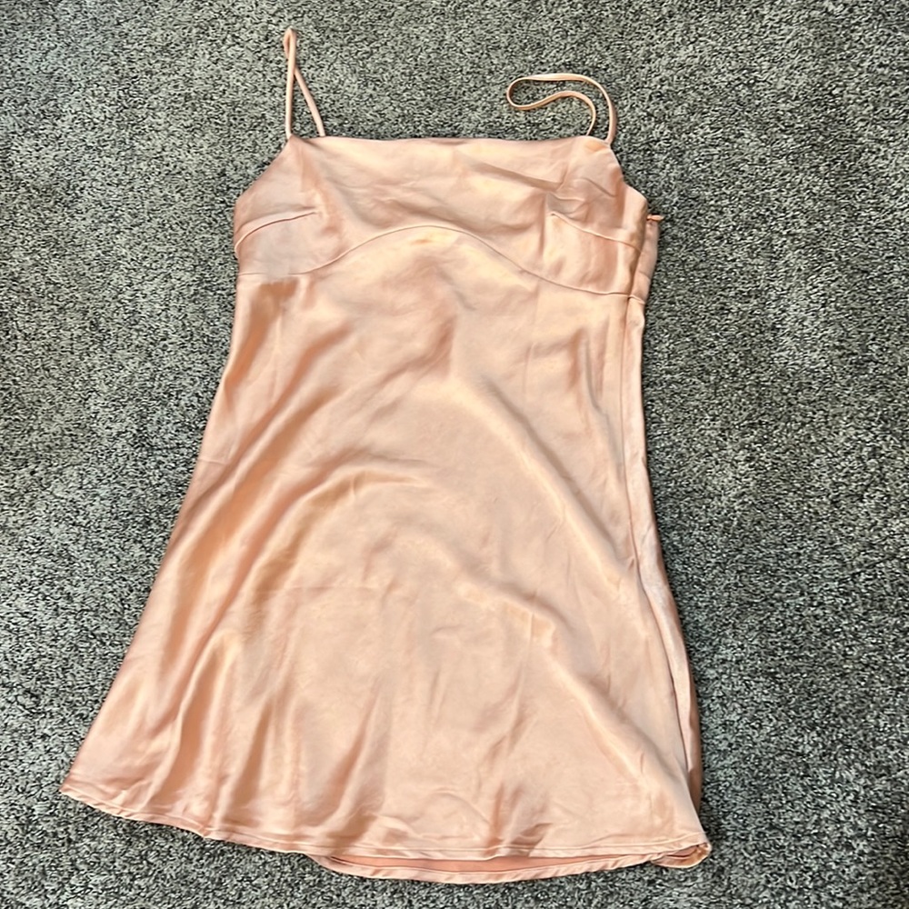 Princess Polly light orange mini dress, silky material, tight and flow at bottom